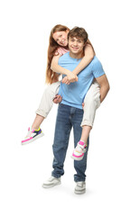 Teenage girl and boy having fun on white background