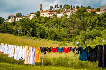 Scenic Hilltop Town Of Stanjel In Slovenia: Traditional Stone Houses And Historic Church Tower...