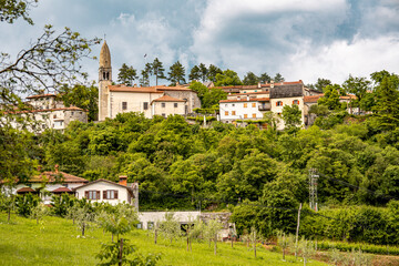 Scenic Hilltop Town Of Stanjel In Slovenia: Traditional Stone Houses And Historic Church Tower...