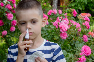 Child Sneezing from Flower Allergy. Selective focus