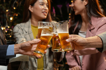 food and drink male friends are happy drinking beer and clinking glasses at a bar or pub.
