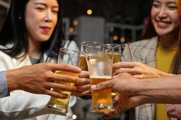 food and drink male friends are happy drinking beer and clinking glasses at a bar or pub.