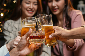 food and drink male friends are happy drinking beer and clinking glasses at a bar or pub.