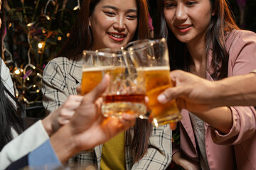 food and drink male friends are happy drinking beer and clinking glasses at a bar or pub.