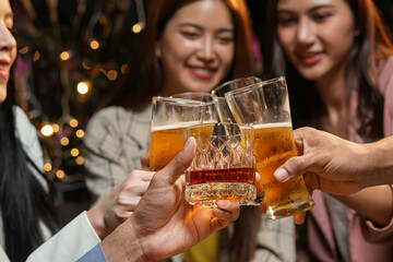 food and drink male friends are happy drinking beer and clinking glasses at a bar or pub.