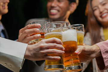 food and drink male friends are happy drinking beer and clinking glasses at a bar or pub.