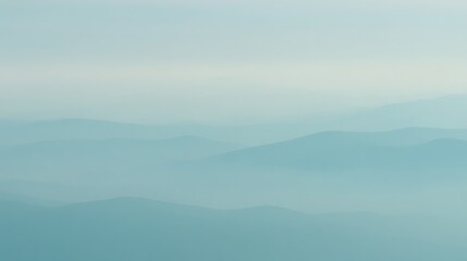 Blue ethereal mountain range in fog