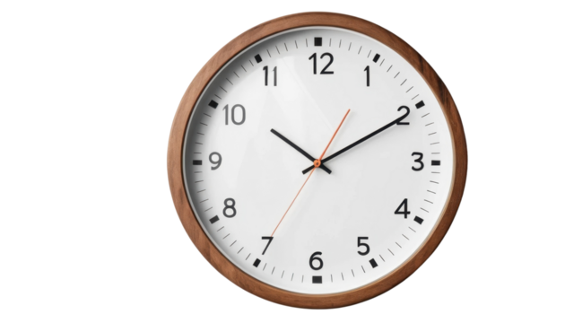 Antique wall clock with black numbers and a white face, isolated on white, marking the time