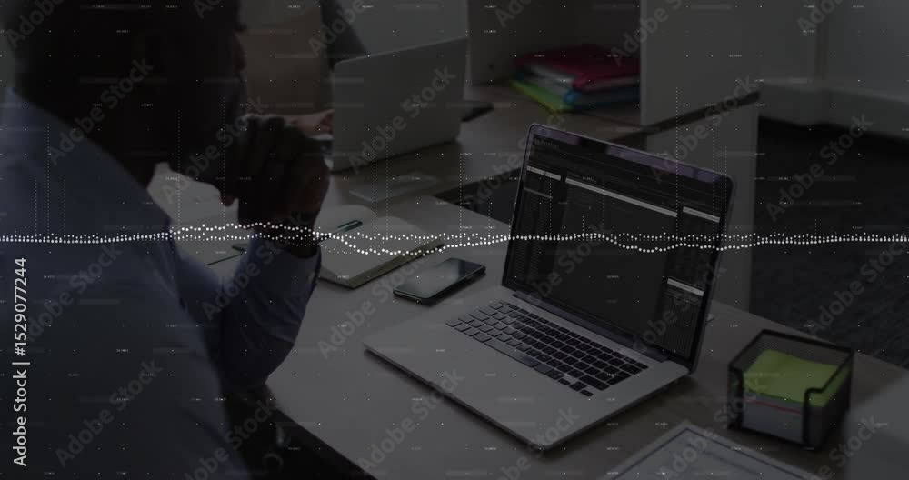 Poster man scanning code for review on laptop causing audio waveform pulsing over desk while woman typing