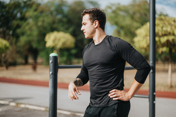 A young man wearing athletic attire exercising at an outdoor park. The sunny weather and open space...
