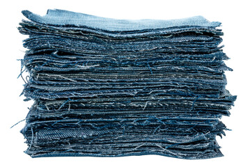 Stack of different pieces jeans on a white background. Denim background texture for design. Canvas denim texture.