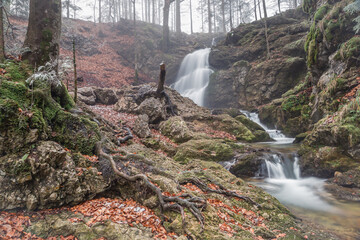 Long Exposure of Josefstaler Waterfall in Autumn Atmosphere in Bavaria, Germany, Europe