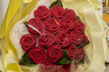 Handmade chocolate flowers, collected in a bouquet. Red, white, blue handmade chocolate flowers.