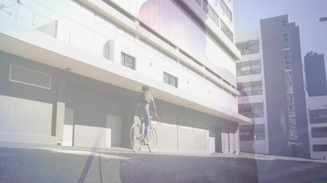 Music artist stepping revealing cyclist pedaling before cyclist exiting artist singing into mic