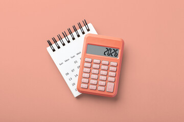 Calculator on calendar on gray background, 2026 new year financial resolutions, budget planning