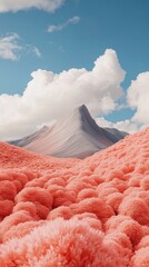 Landscape view of fluffy pink plants in a valley, with mountains and a blue sky with white clouds behind.