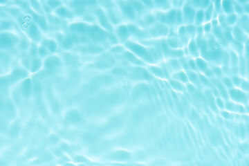 Blue water with ripples on the surface. Defocus blurred transparent blue colored clear calm water...