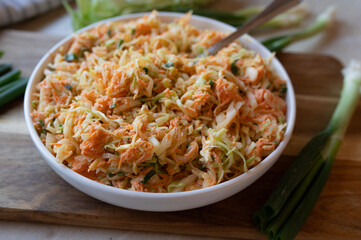 Coleslaw with pointed cabbage and carrots with a light salad dressing fresh and homemade prepared