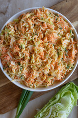 Coleslaw with pointed cabbage and carrots with a light salad dressing fresh and homemade prepared