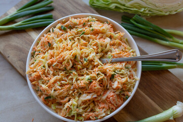 Coleslaw with pointed cabbage and carrots with a light salad dressing fresh and homemade prepared