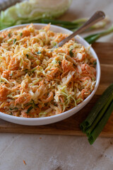 Coleslaw with pointed cabbage and carrots with a light salad dressing fresh and homemade prepared
