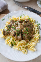 Plate with delicious homemade cooked beef goulash, stroganoff style