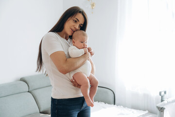 Parenting conception, holding daughter in hands. Woman is with her little toddler baby