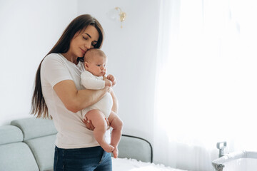Parenting conception, holding daughter in hands. Woman is with her little toddler baby
