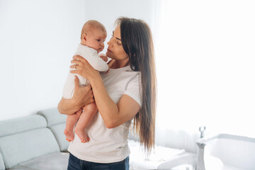 Parenting conception, holding daughter in hands. Woman is with her little toddler baby