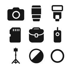 Photography Gear Icons. Solid, Filled icon set of photography gear: DSLR camera, lens, flash unit, memory card, camera bag, remote