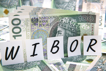 Inscription WIBOR next to polish money. WIBOR is Warsaw Interbank Offered Rate