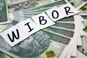 Inscription WIBOR next to polish money. WIBOR is Warsaw Interbank Offered Rate