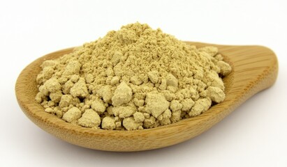 Light beige powder in wooden spoon