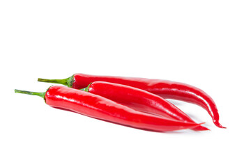 Three pods of red hot chili pepper. Isolated on white.