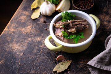 Boiled bone broth or bouillon with meat