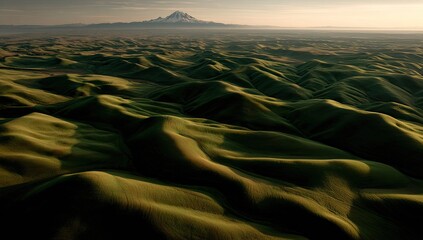 Rolling Hills Landscape With Distant Mountains