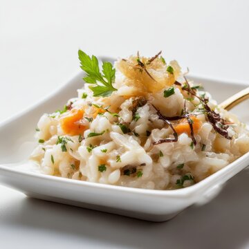 closeup shot ready to serve arroz de raia gourmet food styling minimal white background