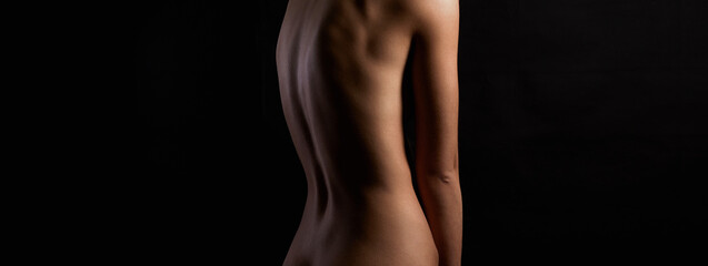 Back of Beautiful Naked Body Girl in Dark