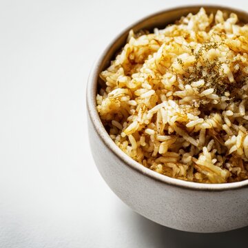 closeup shot ready to serve arroz de carapau gourmet food styling minimal white background