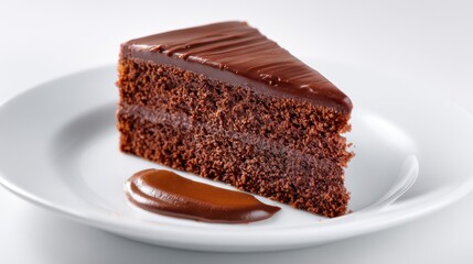Chocolate cake slice on white plate isolated on white