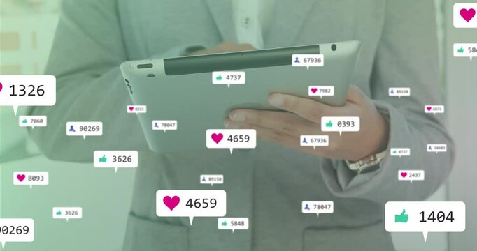 suited man tapping tablet screen generating and adjusting animated floating social media visuals