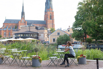 Family with children and pet dog, visiting nortern cities in Sweden, Uppsala