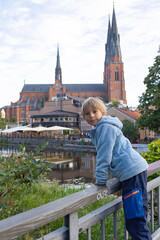 Family with children and pet dog, visiting nortern cities in Sweden, Uppsala