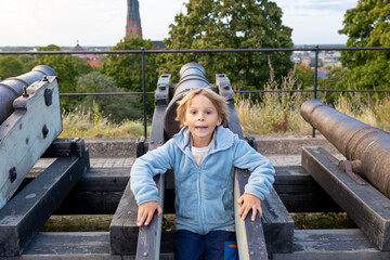 Family with children and pet dog, visiting nortern cities in Sweden, Uppsala