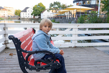 Family with children and pet dog, visiting nortern cities in Sweden, Uppsala