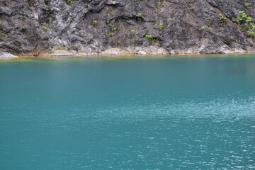 Tham Thong Lang is beautiful and famous tourist attraction in Phang Nga Province, Quarry view point overlooking a large green pond Tham Thong Lang Stone Quarry is located at Ban Nai Wang