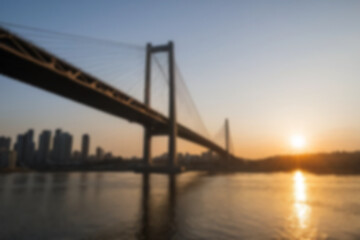 Fototapeta premium blurry photo of bridge in the afternoon showing beautiful sunset radiating from the corner of the bridge
