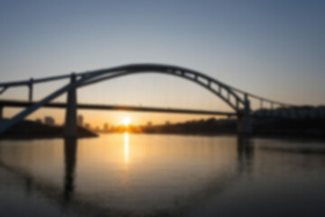 Fototapeta premium blurry photo of bridge in the afternoon showing beautiful sunset radiating from the corner of the bridge