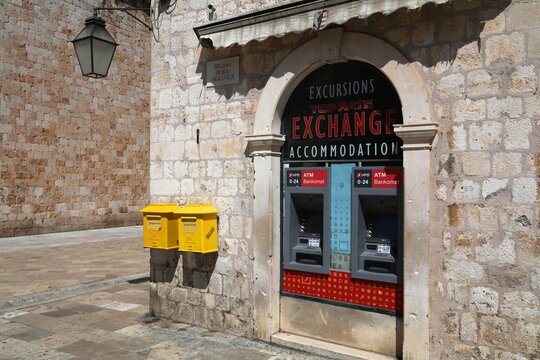 DUBROVNIK, CROATIA - JULY 18, 2021: ATM cash machines of HPB Bank and public mail boxes in Dubrovnik, Croatia.