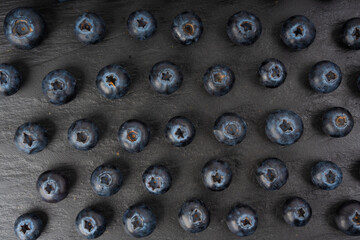 Blueberry texture background. Fresh blue berry fruits pattern, bilberry wallpaper with copy space